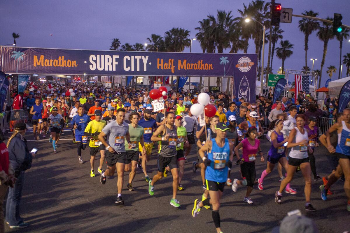 Runners race along the Surf City Marathon course in 2017.