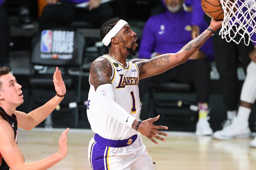 ORLANDO, FLORIDA OCTOBER 11, 2020-Lakers Kentavious Caldwell-Pope beats Heats Duncan Robinson.