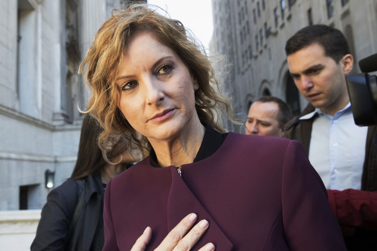 FILE - In this Oct. 18, 2018 file photo, former "Apprentice" contestant Summer Zervos leaves New York state appellate court in New York. Former President Donald Trump could face sworn questioning about her sexual assault allegations after a ruling from New York's highest court, Tuesday, March 30, 2021, in her defamation case. (AP Photo/Mary Altaffer, File)