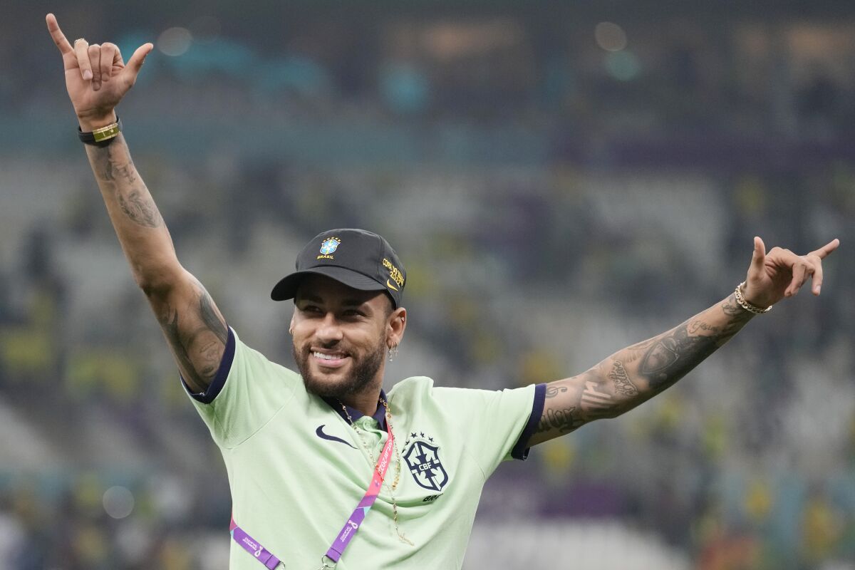 Brazil's Neymar greets the supporters after the World Cup group G soccer match between Cameroon and Brazil, at the Lusail Stadium in Lusail, Qatar, Saturday, Dec. 3, 2022. (AP Photo/Moises Castillo)