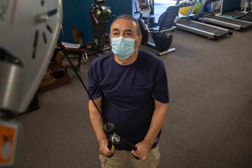El Cajon, CA - July 29: David Arellano does physical therapy at Spine & Sport Physical Therapy on Thursday, July 29, 2021 in El Cajon, CA. (Jarrod Valliere / The San Diego Union-Tribune)