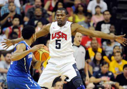 Kevin Durant uses his long arms to guard Juan Coronado Gill of the Dominican Republic during a pre-Olympic exhibition game in Las Vegas. The United States won, 113-59.