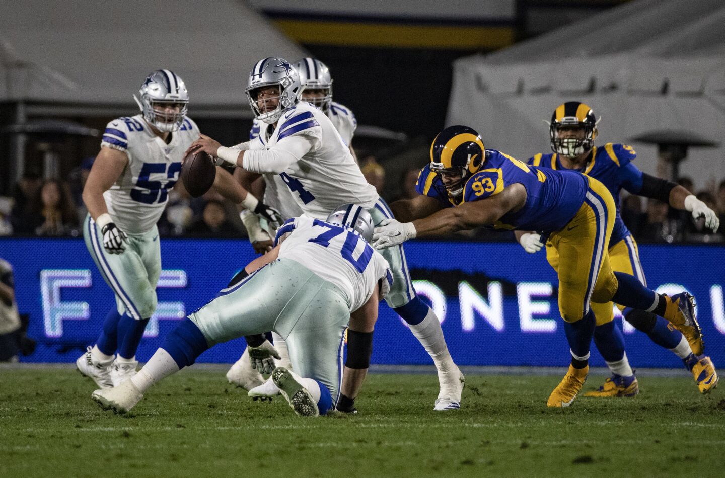 Rams nose tackle Ndamukong Suh (93) tries to sack Cowboys quarterback Dak Prescott during the first half.