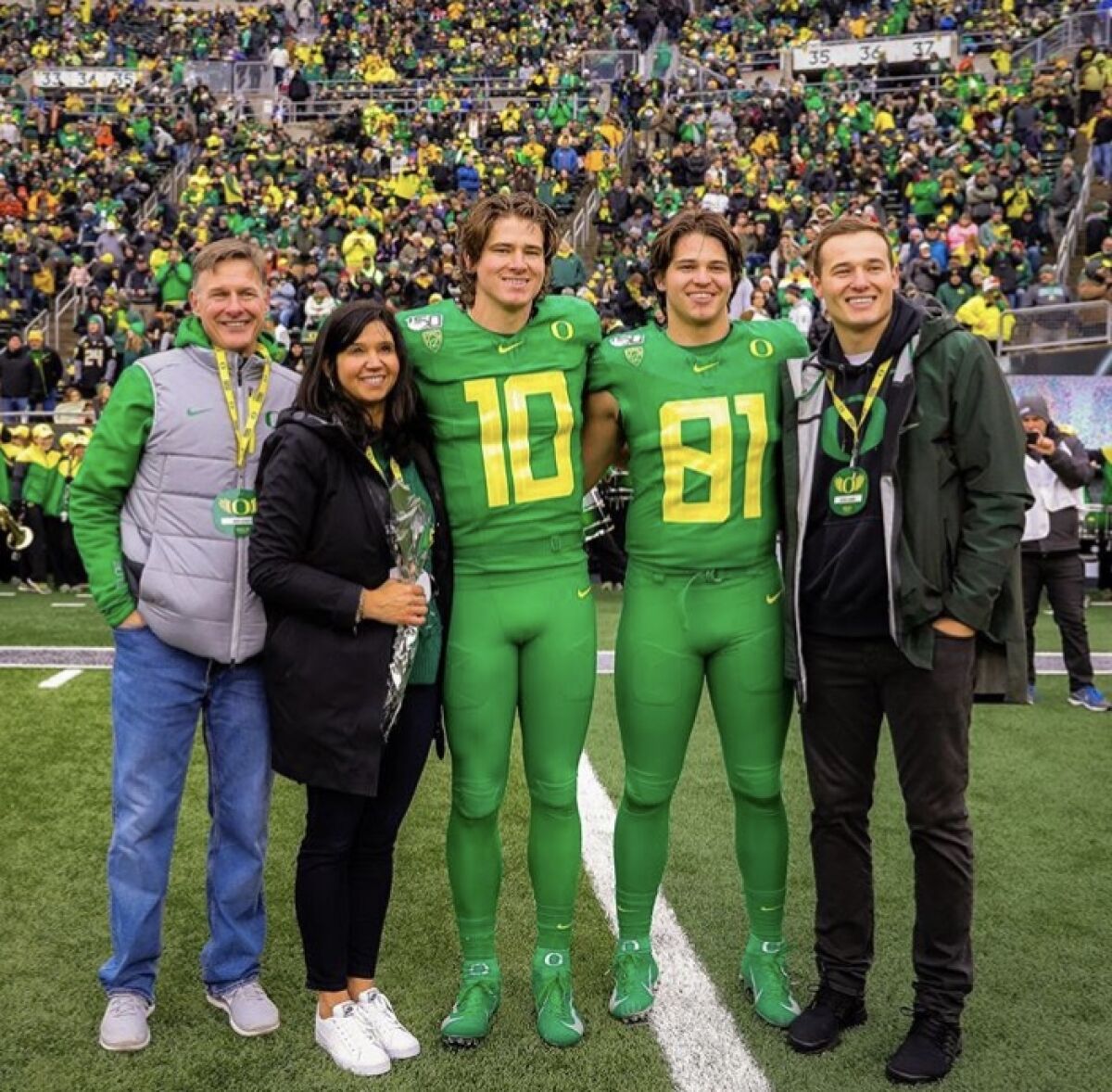 The Herbert family poses for a photo at an Oregon game. (From left to right: Mark, Holly, Justin, Patrick and Mitchell Herbert.)