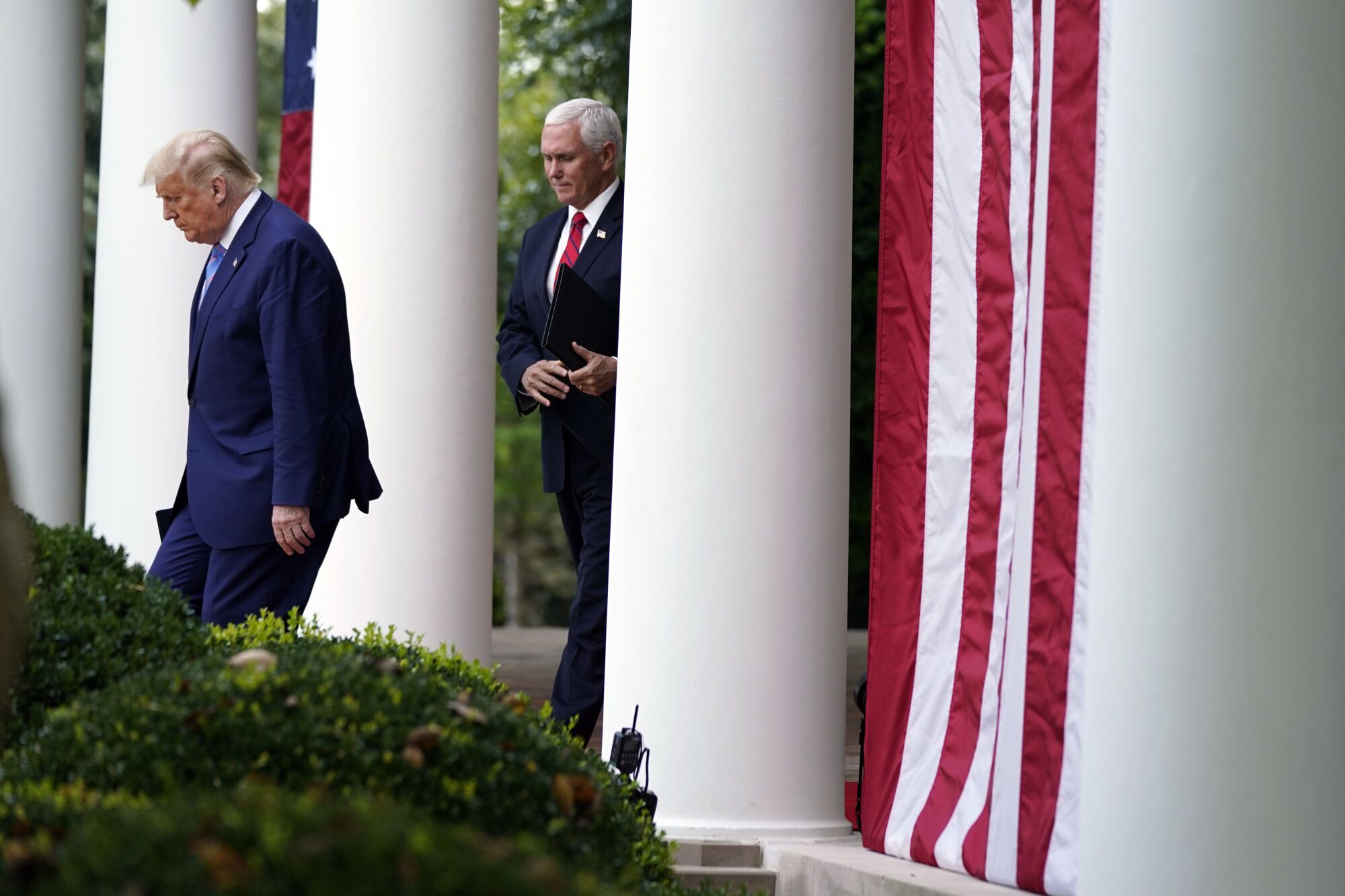 President Trump arrives with Vice President Mike Pence in the Rose Garden