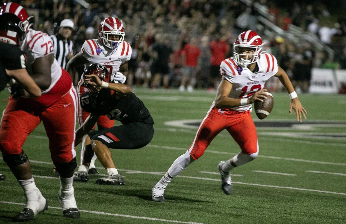 Mater Dei quarterback Elijah Brown scrambles against Corona Centennial.