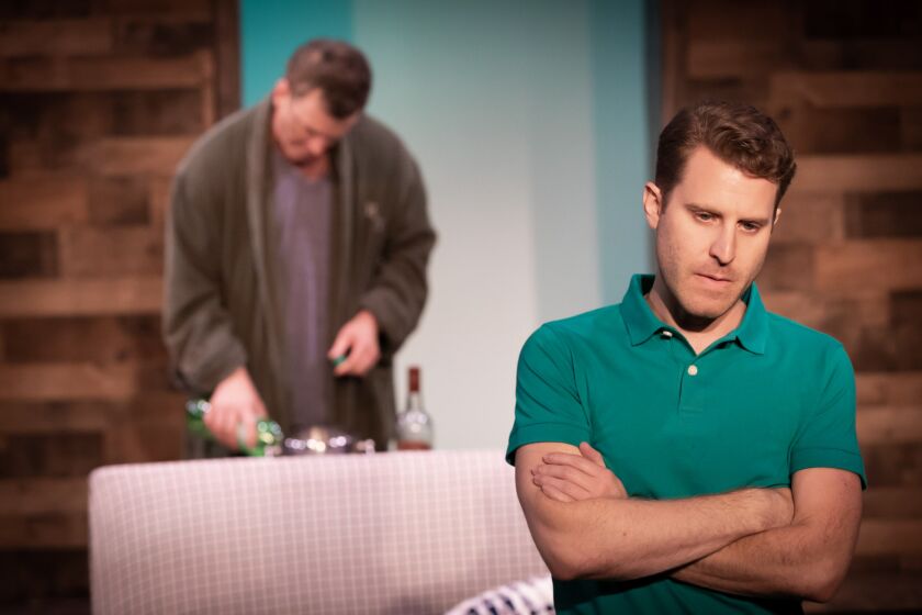 Andrew Carter (with Josh Randall in the background) plays the protagonist of Rider Strong's new play “Never Ever Land,”  a Theatre Unleashed production in L.A.'s Koreatown.
