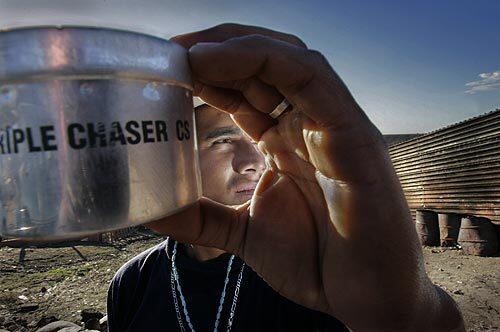 U.S. Border Patrol agents have battled rock-throwing attackers by launching pepper spray and tear gas into Mexican border neighborhoods, according to witnesses, Mexican authorities and human rights groups. Here, Alfredo Aceves, 24, holds a tear gas canister that he says landed in his carpenter shop two weeks ago.
