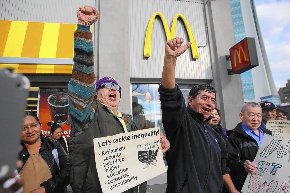 Activists call for higher wages outside a McDonald's in Stamford, Conn.