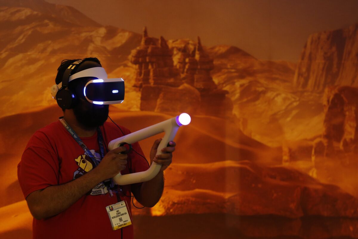 A visitor at the Electronic Entertainment Expo tests out "Farpoint," an in-development game coming for Sony's PlayStation VR.