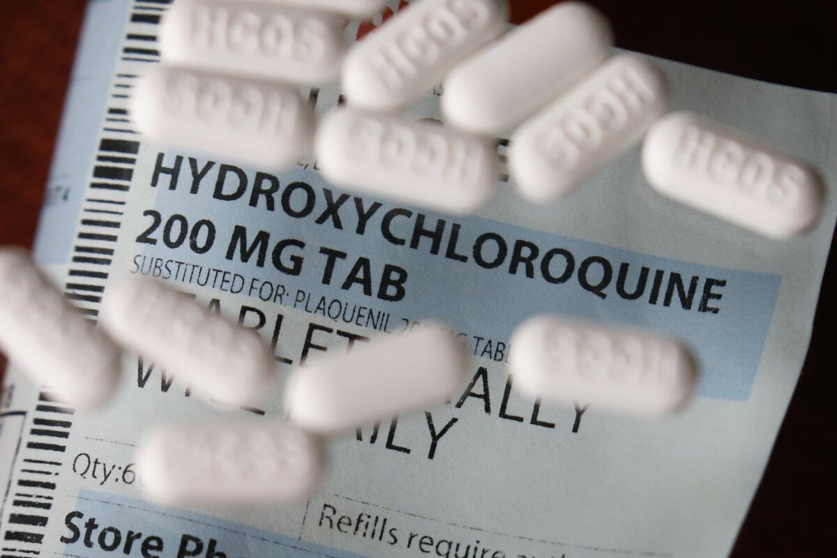 Hydroxychloroquine pills spread out on a prescription sheet.