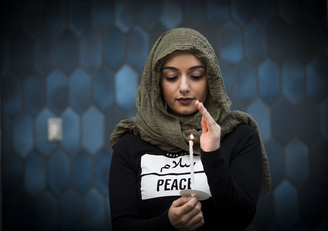 Marwa Balkar holds a candle at the Islamic Center of Southern California and ICUJP Interfaith Vigil Against Violence and Hatred on June 13, 2016, in remembrance of the 49 people killed in Orlando, Fla.