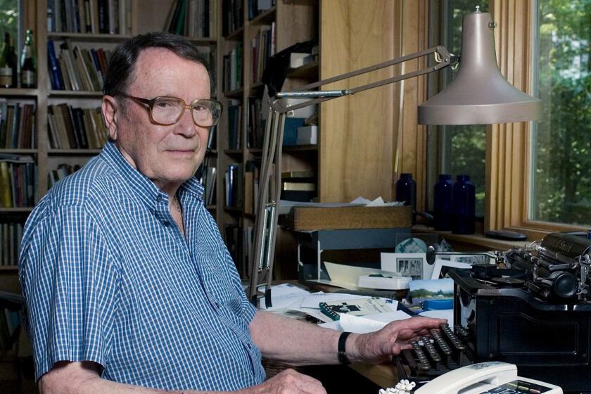 ** ADVANCE FOR SUNDAY, JAN. 14 ** Richard Wilbur, a Pulitzer prize winner and former poet laureate, poses beside his manual typewriter in his studio in Cummington, Mass. Tuesday, July 18, 2006. (AP Photo/Nancy Palmieri) ORG XMIT: NY331