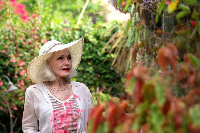 LOS ANGELES, CA-July 18, 2019: Famed actress and dancer, Julie Newmar, inside her fantastically colorful garden on Thursday, July 18, 2019.