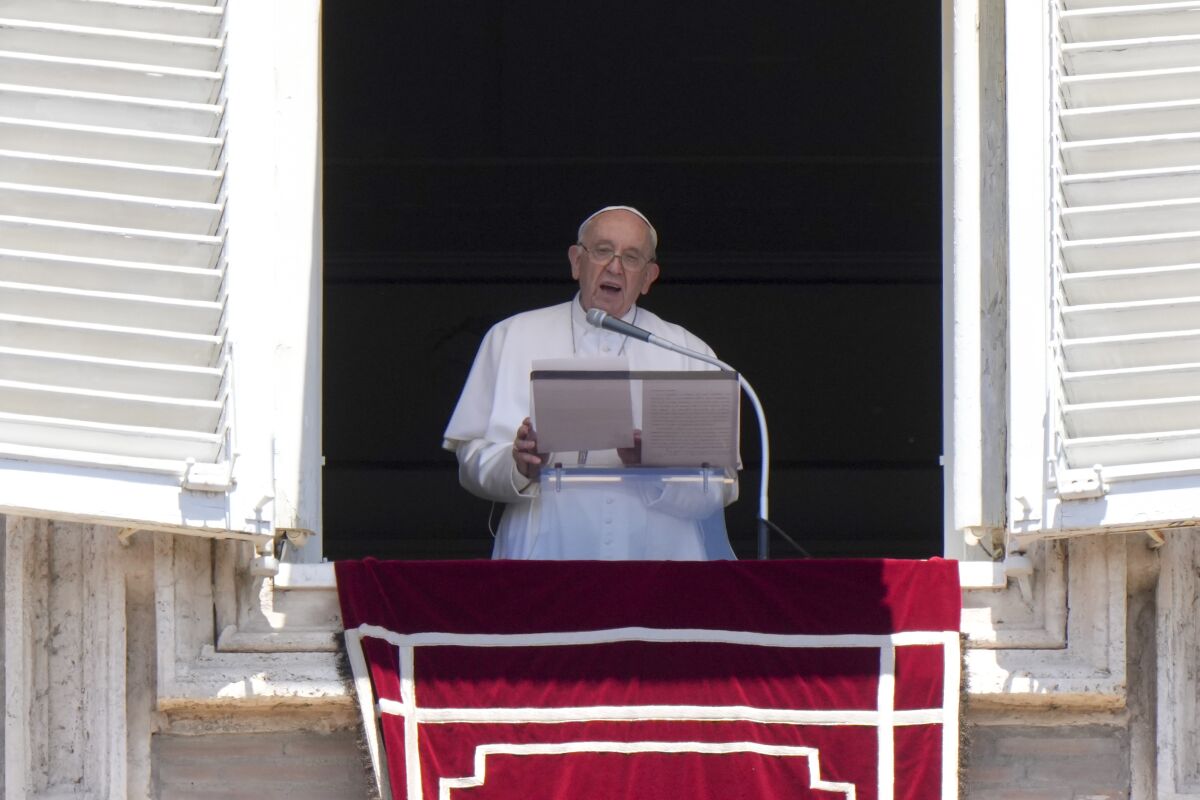 Pope Francis delivers his speech as he recites the Regina Coeli noon prayer from the window of his studio overlooking St. Peter's Square, at the Vatican, Sunday, June 12, 2022. (AP Photo/Andrew Medichini)