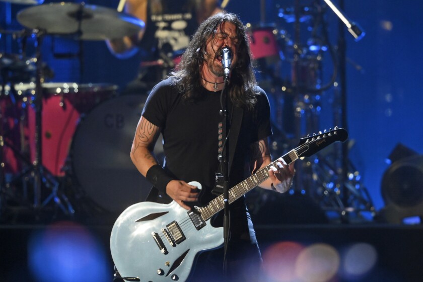 FILE - Dave Grohl performs with the Foo Fighters during the Rock & Roll Hall of Fame induction ceremony, Sunday, Oct. 31, 2021, in Cleveland. The Foo Fighters rock band has called off its concert at the Formula One race in Abu Dhabi due to "unforeseen medical circumstances," event organizers said on Sunday, Dec. 12, 2021. (AP Photo/David Richard, File)
