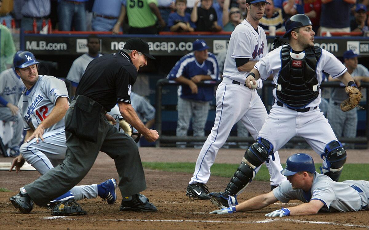 The Dodgers' Jeff Kent, left, and J.D. Drew were both tagged out at home by Mets catcher Paul Lo Duca in the second inning of Game 1 of the 2006 National League division series.