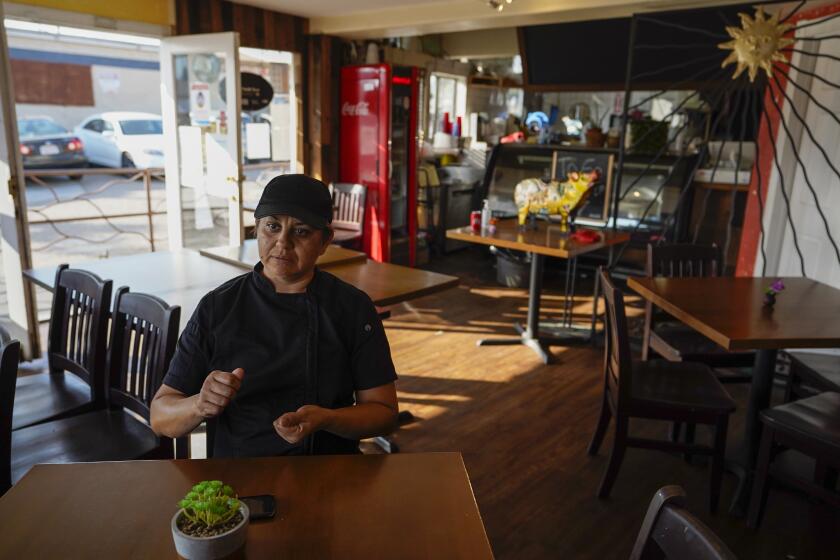 SAN YSIDRO, CALIFORNIA - SEPTEMBER 03: Inside the dining area Chef Silvana Alaniz 42, talks about sending remittances to Mexico during the pandemic at El Rincon Restaurant on Thursday, Sept. 3, 2020 in San Ysidro, California. (Alejandro Tamayo / The San Diego Union-Tribune)