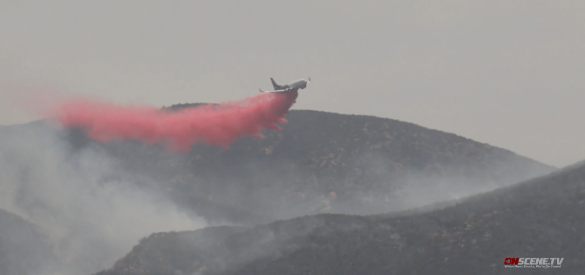 A plane dropped retardant on the Border 27 fire that charred about 100 acres near the U.S.-Mexico border Sunday afternoon.