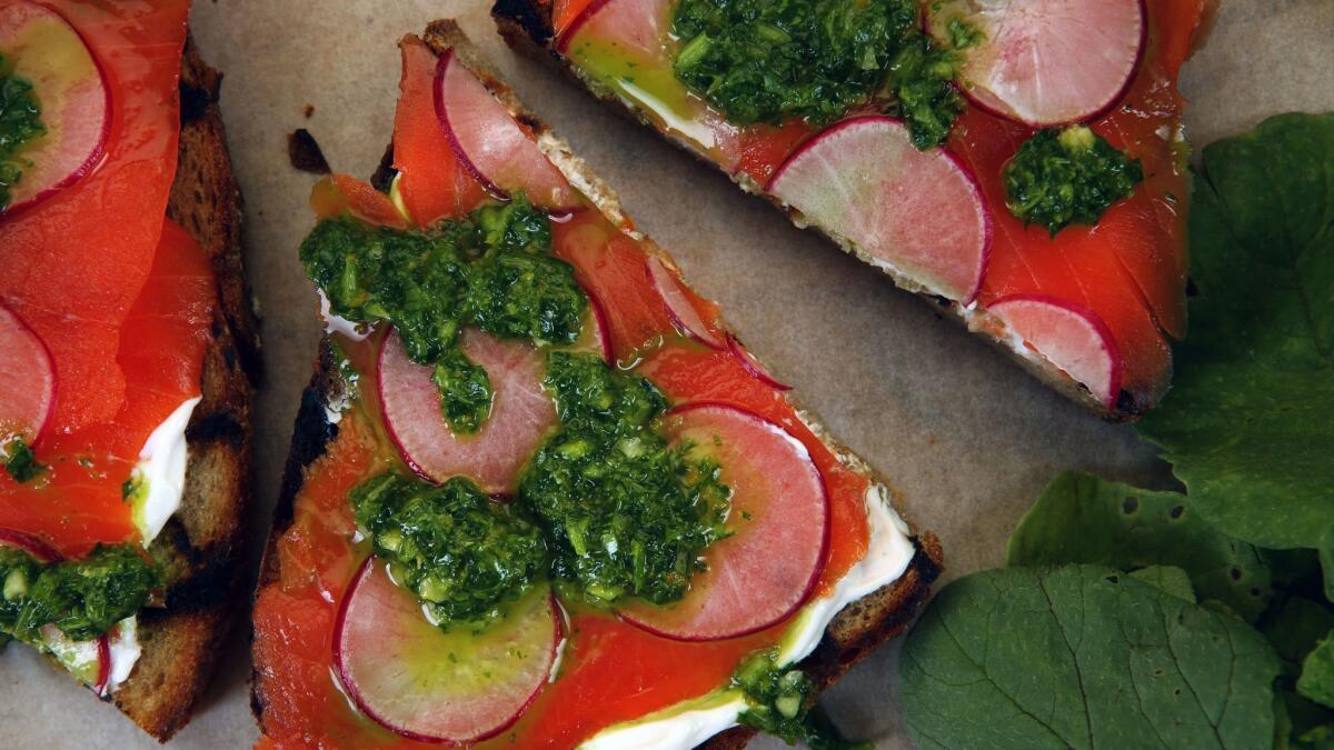Salmon and radish green salsa verde toasts.