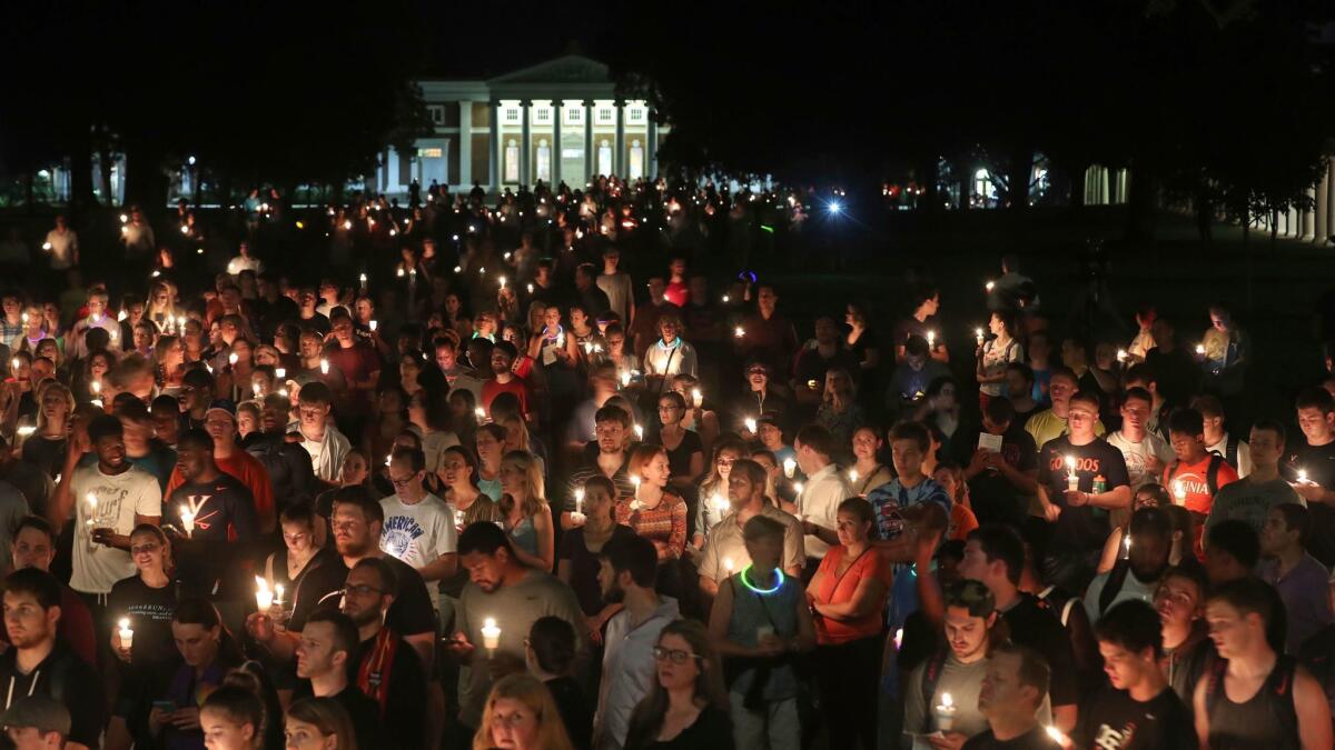 University of Virginia students, faculty and residents attend a candle light march in Charlottesville, Va. on Aug. 16.