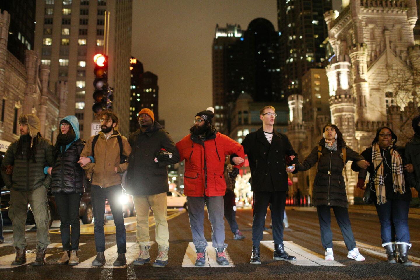 Protesters link arms to block North Michigan Avenue and show support for police shooting victim Laquan McDonald on Nov. 27, 2015, in Chicago.