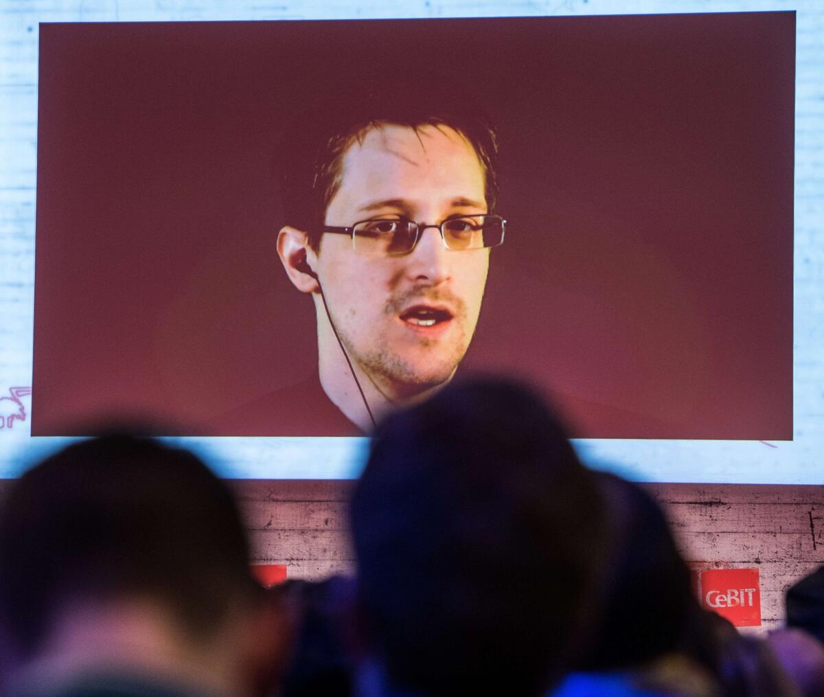 Edward Snowden speaks via live video call during the CeBIT technology fair in Hanover, Germany on March 18. International speakers from business and government discuss the big issues and challenges of the digital world during the fair.