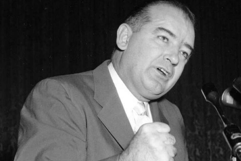 **FILE**Sen. Joseph McCarthy, R-Wis., pounds the podium as he addresses a group of 3,000 admirers at Constitution Hall in Washington, Nov. 11, 1954. McCarthy backers from many cities came to Washington to stage the rally, which was held to protest the censure move against the senator. The new film "Good Night, and Good Luck," deals with CBS newsman Edward R. Murrow's battle against McCarthy, who was on an anti-communist crusade. What is in film is essentially accurate, experts say. They note that the movie leaves out such aspects as the mention of journalists who had already stood up to McCarthy to signs that the senator was already on his way down. (AP Photo/Bob Schutz) ORG XMIT: NYET196