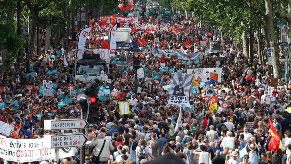 Protesters took to the streets of Paris on Saturday to denounce new government economic policies.