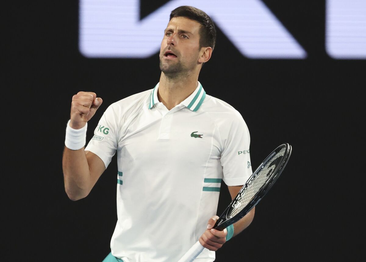 Novak Djokovic pumps his fist.