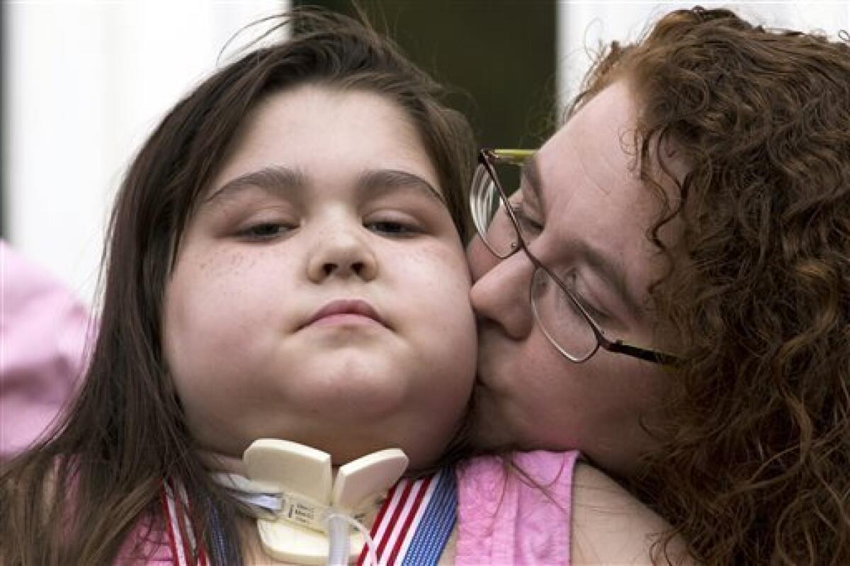 Lung transplant recipient Sarah Murnaghan, 11, with her mother, Janet, after arriving home from the hospital.