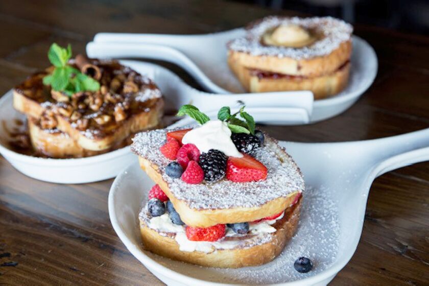 A trio of French toast options are among brunch menu items at The Duck Dive in Pacific Beach.