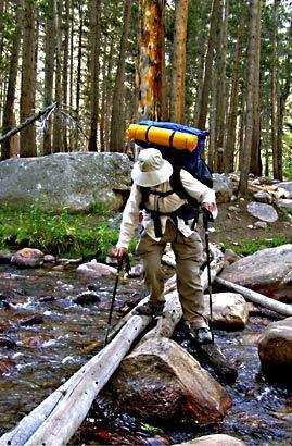 Blanch Kosche, 70, crosses Rock Creek. Her pack weighed 38 pounds at the start of the trip.