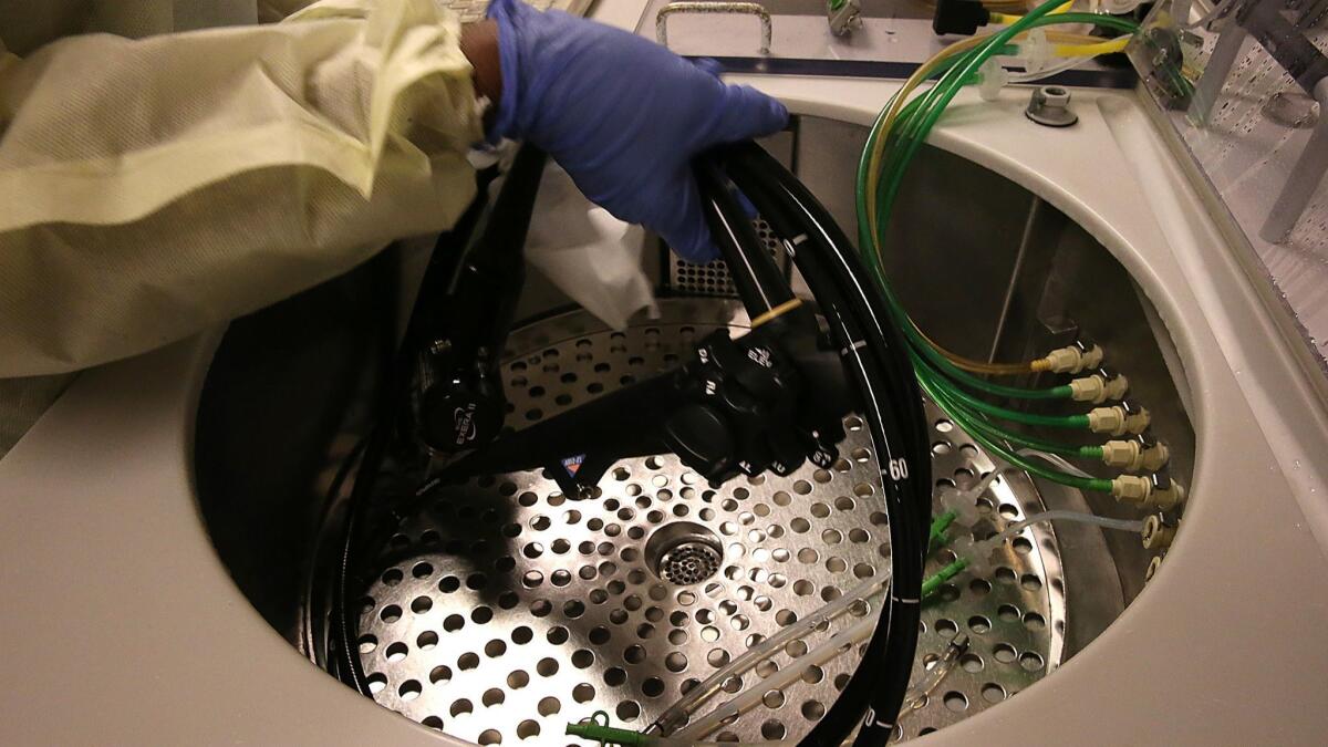 An duodenoscope is cleaned at L.A. County/USC Medical Center. A study found problems in scopes used for colonoscopies, lung procedures and other routine operations.