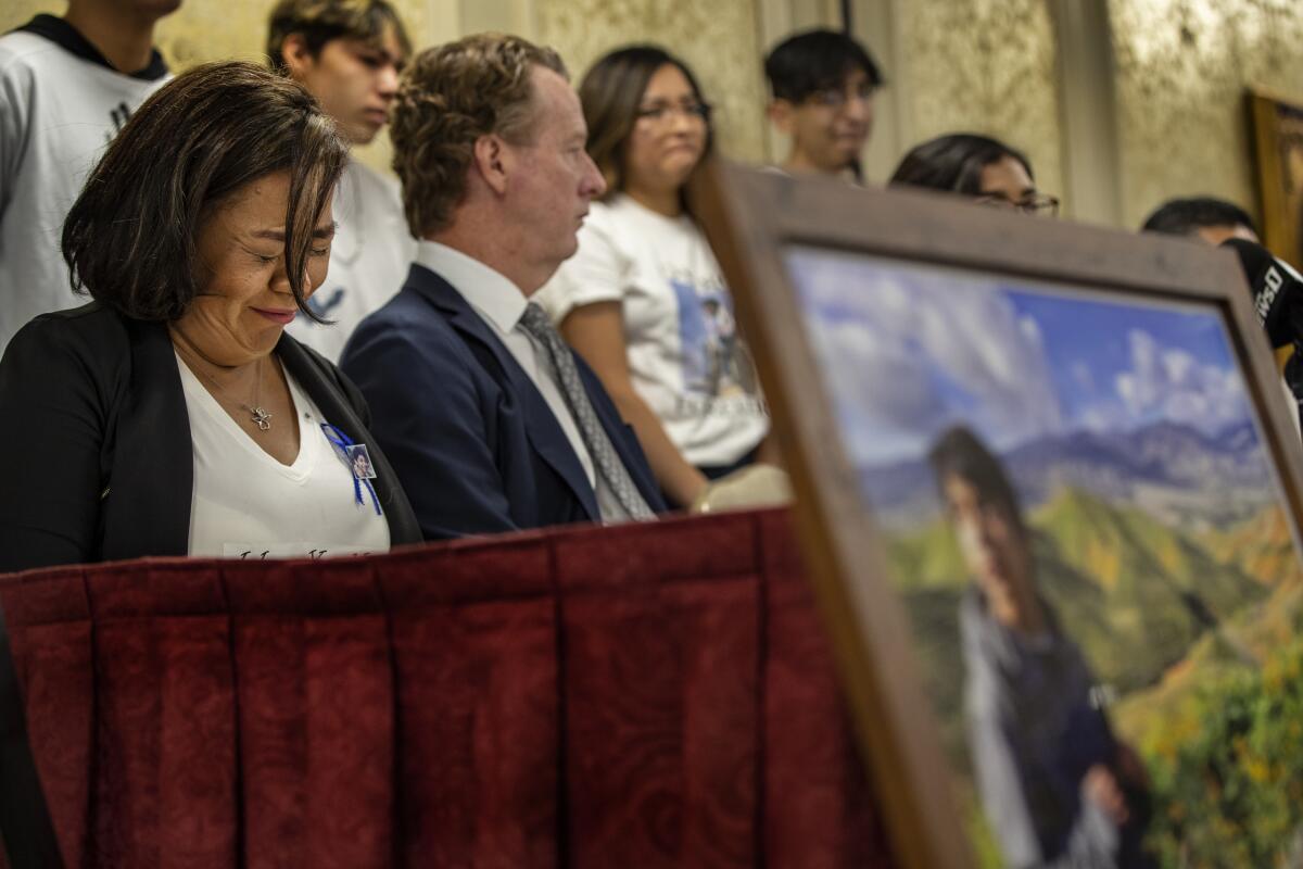 Juana Salcedo, guardian of Diego Stolz, weeps at a news conference