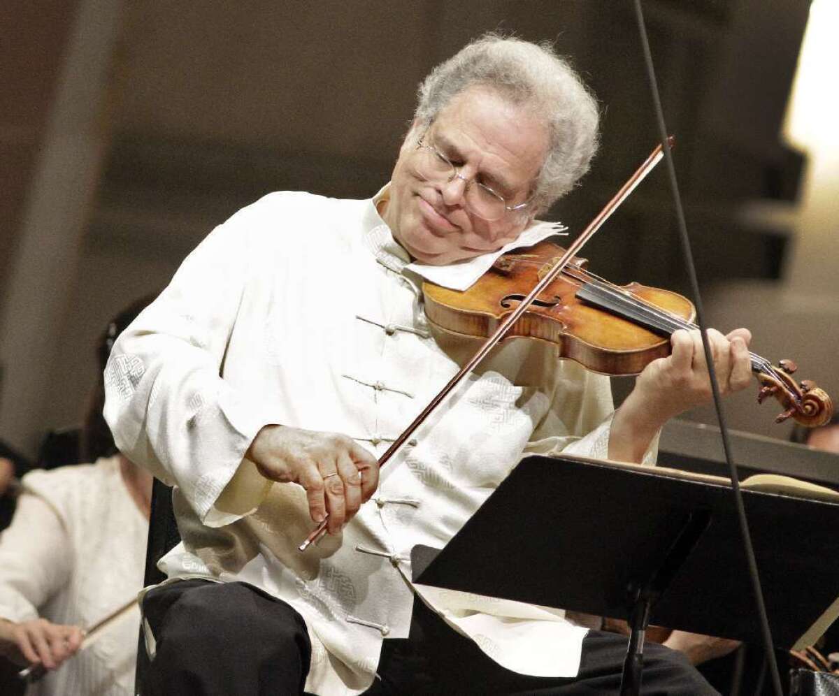 Itzhak Perlman is seen performing with the Los Angeles Philharmonic at the Hollywood Bowl in 2011.