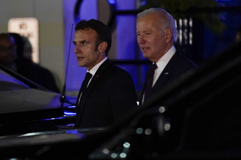 President Joe Biden and French President Emmanuel Macron depart after eating dinner at Fiola Mare in Washington, Wednesday, Nov. 30, 2022. (AP Photo/Andrew Harnik)