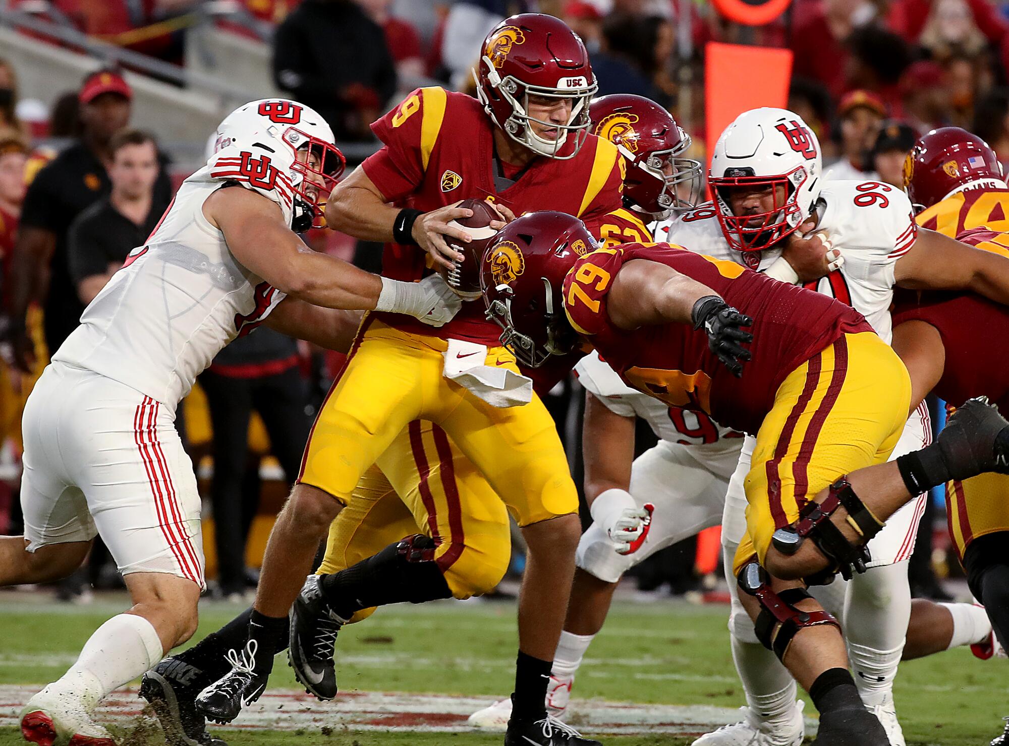 USC quarterback Kedon Slovis is sacked by Utah defensive lineman Mika Tafua.