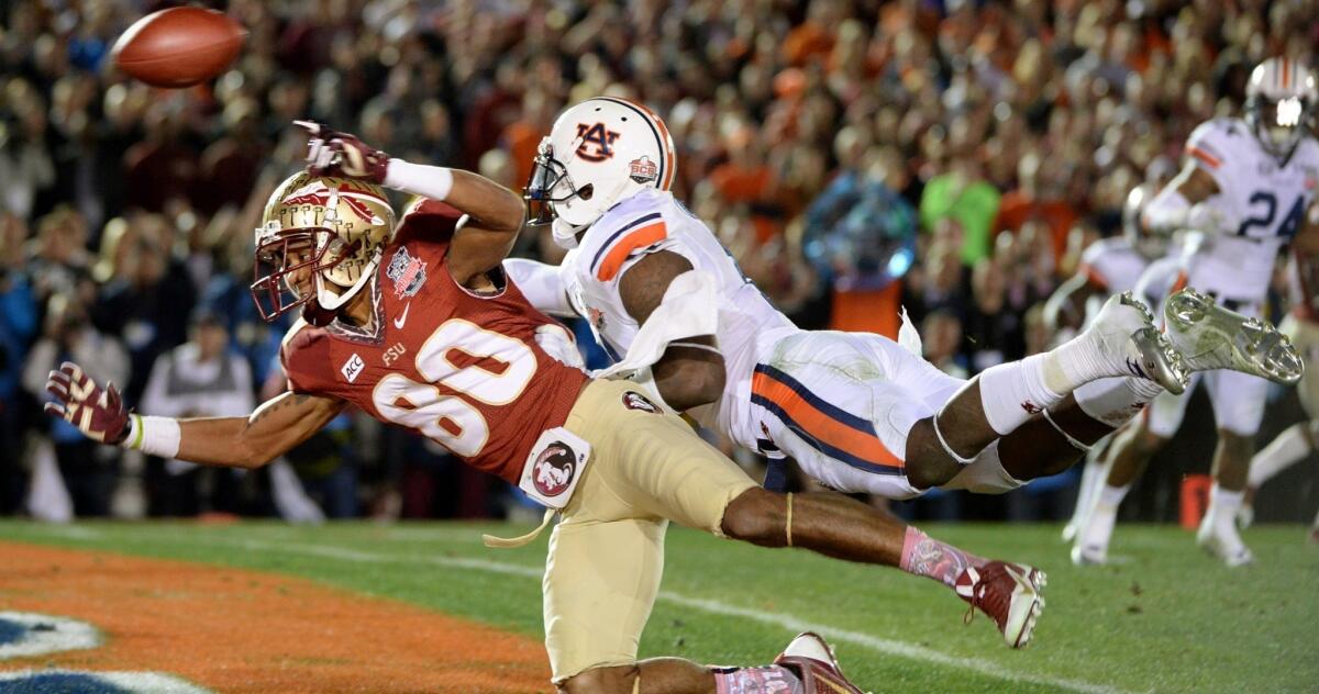 Auburn cornerback Chris Davis makes contact with Florida State receiver Rashad Greene in the end zone on a third-and-goal play in the final minute of the BCS title game, drawing an interference penalty.