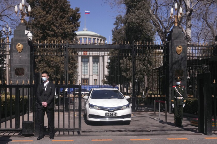 A Chinese paramilitary policeman stands guard a the entrance to the Russian Embassy in Beijing on Tuesday, March 1, 2022. As the West condemns Russia, President Vladimir Putin has vocal supporters in China, where the ruling Communist Party tells its people they are a fellow target of U.S.-led harassment. Public sentiment largely reflects the stance of a ruling party that is the closest thing Putin has to a major ally: The war should stop but the United States is to blame. (AP Photo/Ng Han Guan)