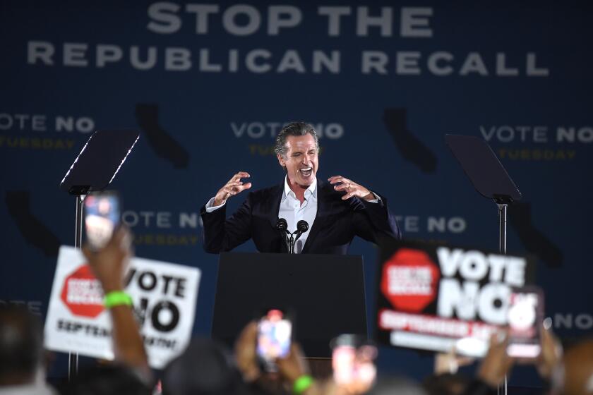 Long Beach, CA - September 13: California Governor Gavin Newsom cheers with the crowd after appearing with U.S. President Joe Biden during a recall "no vote" campaign event for him at Long Beach City Collage, on Monday, Sept. 13, 2021 in Long Beach, CA. (Wally Skalij / Los Angeles Times)