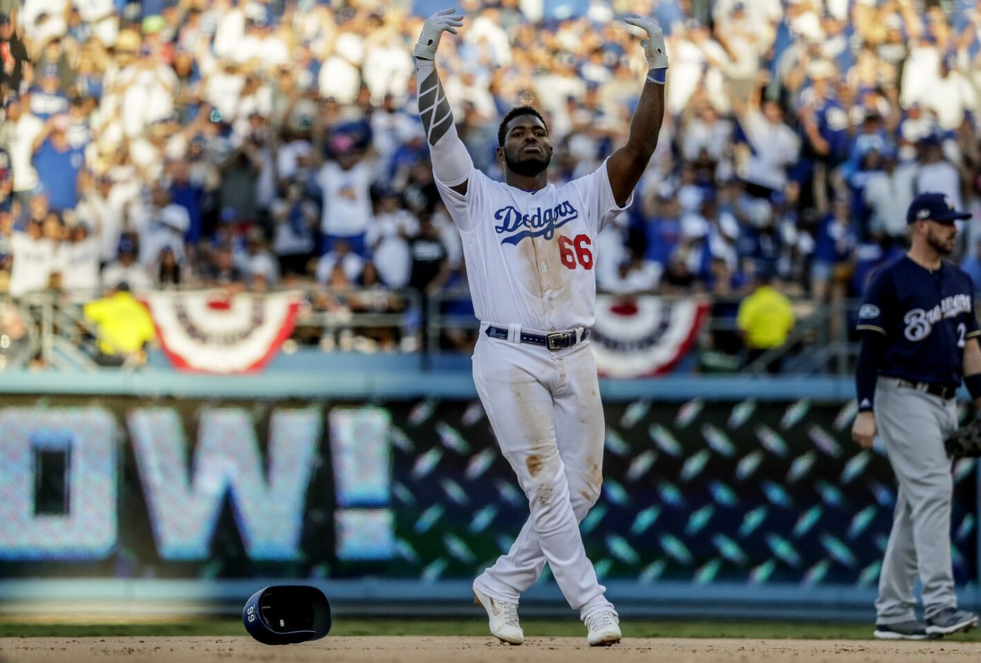 Dodgers Yasiel Puig celebrates hitting a double in the eighth inning.