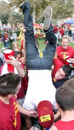 USC fan Vincenzo Nocerino does a keg stand during a tailgate party before USC's homegame versus Oregon on October 4.