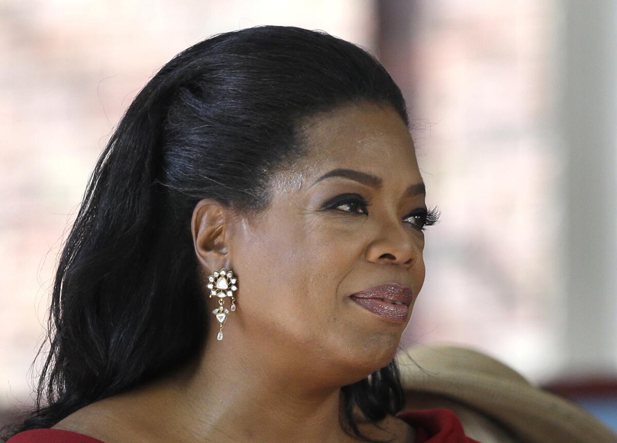 The Oprah Winfrey Network said Wednesday it would offer two longtime soaps. Above, Oprah Winfrey is seen after delivering the commencement address at Harvard University in Cambridge, Mass., in May.