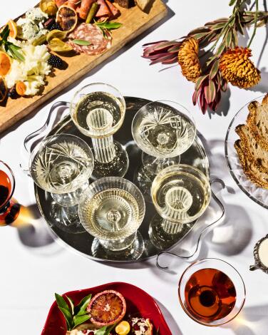 A Thanksgiving spread including champagne coupes, seen from above
