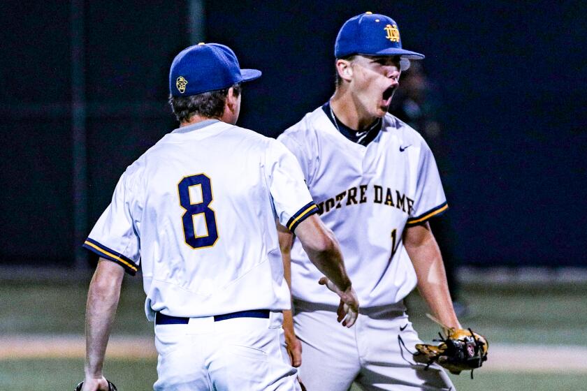 A fired up Levi Sterling of Sherman Oaks Notre Dame reacts after picking up a save against Harvard-Westlake.
