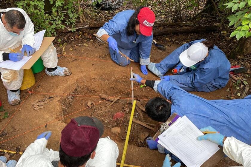 Mexican forensic officials practice excavating a grave at the University of Tennessee’s Forensic Anthropology Center.