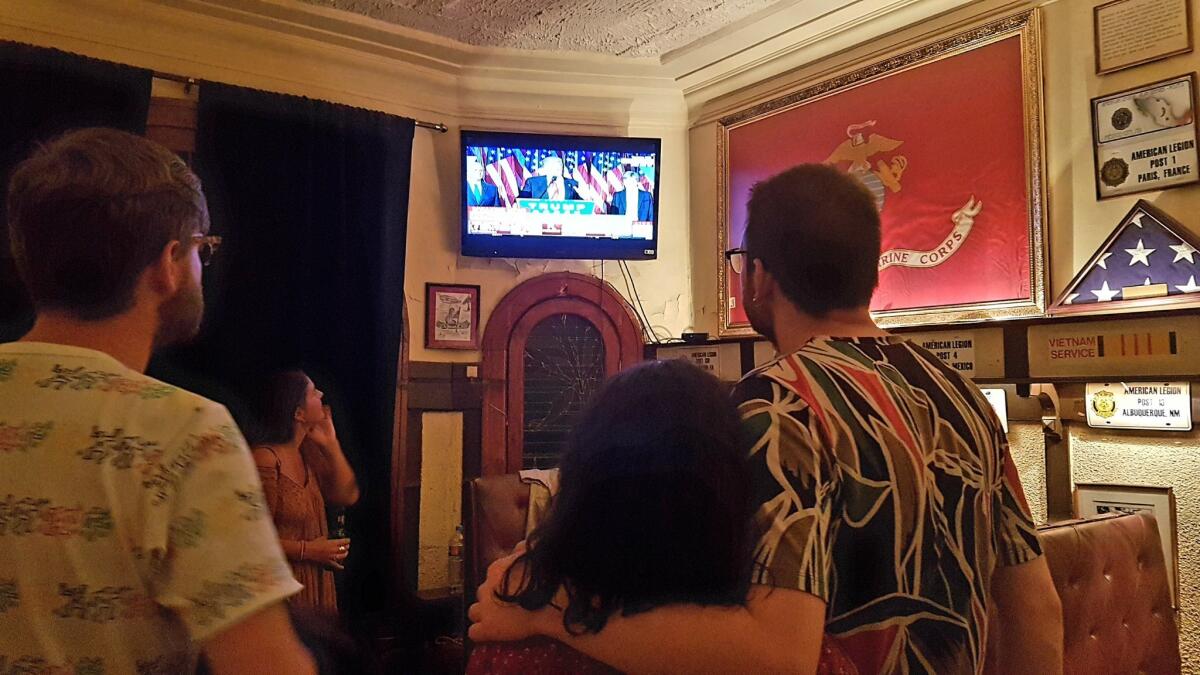 Patrons in a Mexico City bar watch as Donald Trump gives his acceptance speech