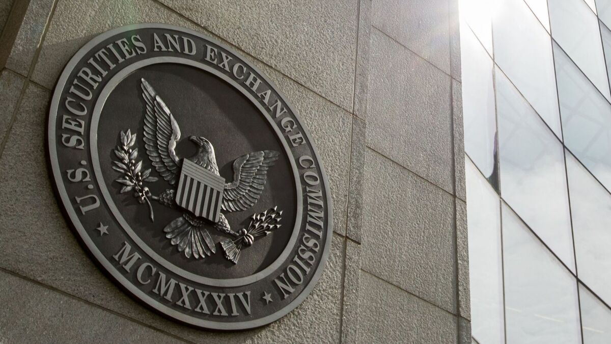 The seal of the U.S. Securities and Exchange Commission at SEC headquarters in Washington is shown. The agency has alleged Craig Arsenault, a Laguna Niguel money manager, committed civil securities fraud.