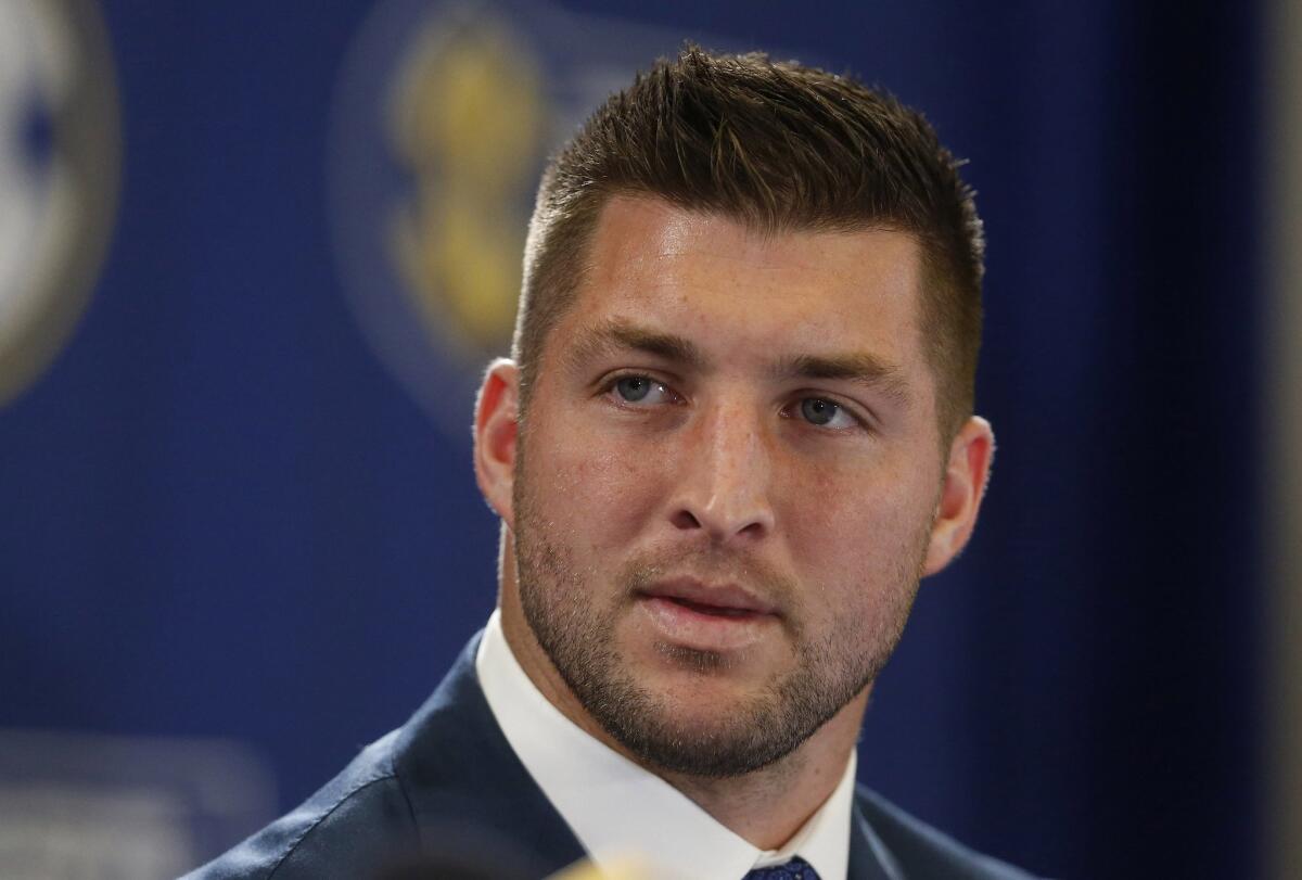 Tim Tebow speaks during an SEC TV broadcast in 2014.